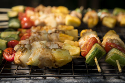 Close-up of meat and vegetables on barbecue grill