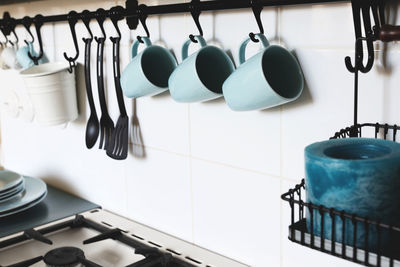 Interiors. pretty wall in the kitchen with some blue cups