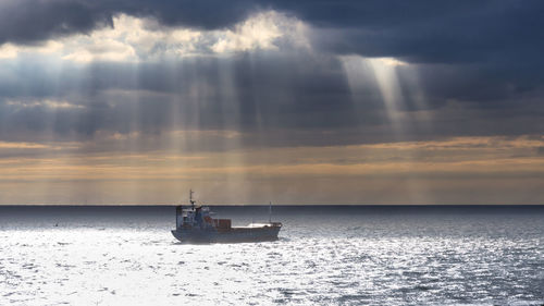 Scenic view of sea against cloudy sky