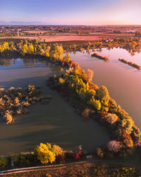 Scenic aerial view of lake against sky during autumn sunrise in casale sul sile countryside