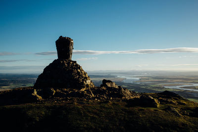 Monument on hill against sky at dumyat