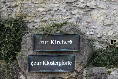 Close-up of information sign on wall
