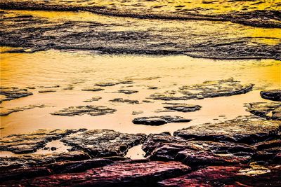 Text on beach during sunset