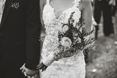 Close-up woman holding wedding bouquet