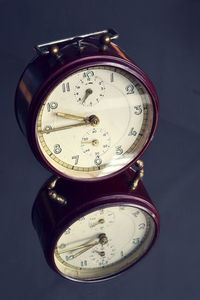 High angle view of clock on table