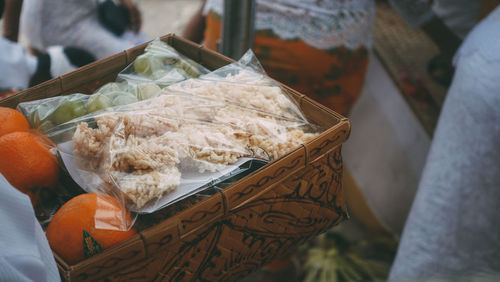 Close-up of hand holding basket 