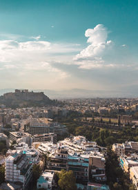 High angle view of buildings against sky in athens greece with acropolis