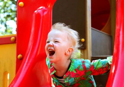 Cute girl in red playground