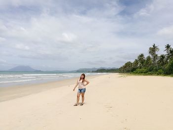 Friends walking on beach