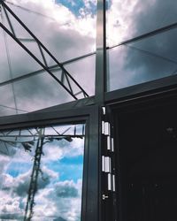 Low angle view of building against cloudy sky