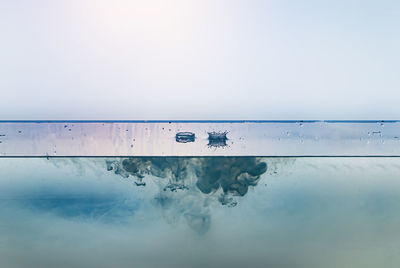 Close-up of swimming pool against sky