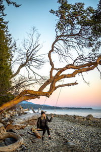 Man on beach against sky