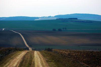 Country road passing through landscape