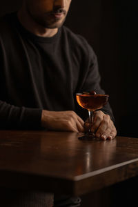 Men with a drink on table