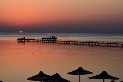 Scenic view of sea against sky during sunrise 