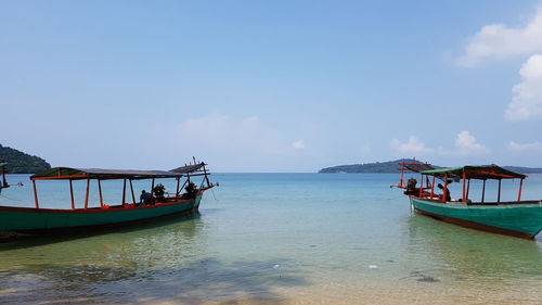 Boat in sea against sky