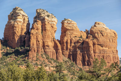 Rock formations on mountain against sky