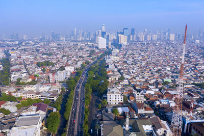 High angle view of modern buildings in city against sky