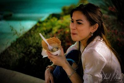 Portrait of woman holding ice cream