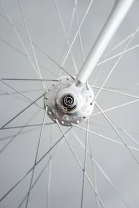 Close up of bicycle against light gray background.