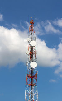 Low angle view of communications tower against sky