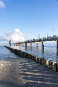 Pier over sea against sky