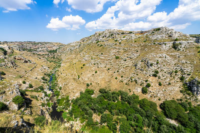 Scenic natural landscape of gravina ravine in matera in a summer day, basilicata, italy