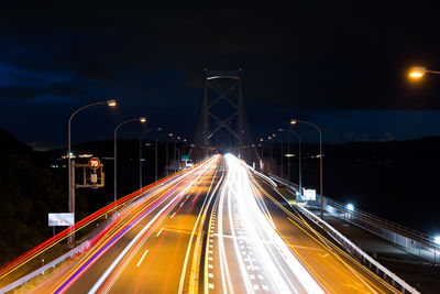 High angle view of light trails on road at night