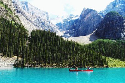 Scenic view of lake with mountains in background