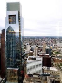 Modern buildings in city against sky