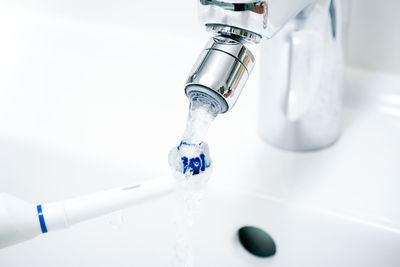 Close-up of water falling from faucet