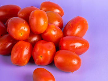 Close-up of tomatoes over white background