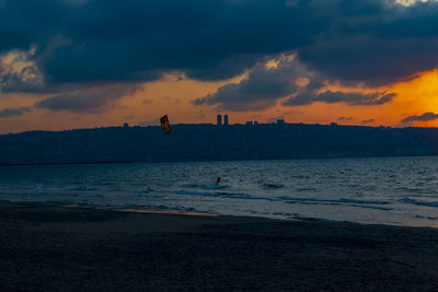 Kite surfing at dusk in qiryat yam israel