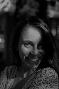 Close-up portrait of a smiling young woman