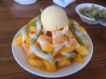 Close-up of ice cream served on table