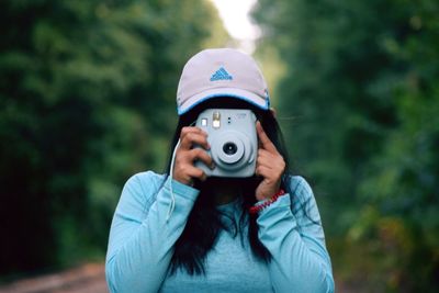 Close-up of man holding camera