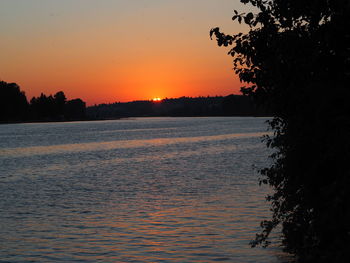 Scenic view of sea against orange sky