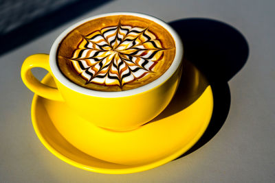 Close-up of coffee cup on table