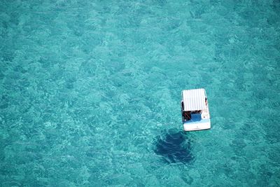 Directly above shot of pedal boat on sea during sunny day