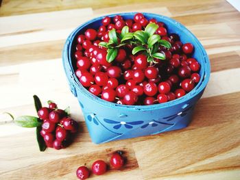 High angle view of strawberries in bowl on table