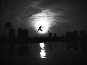 Calm river with buildings in background