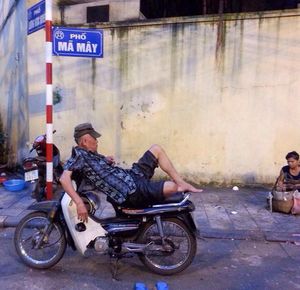 Man riding bicycle on road