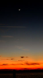 Scenic view of sea against sky at sunset