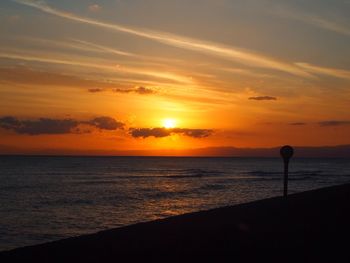 Scenic view of sea at sunset