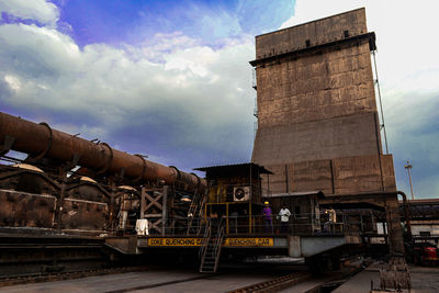 Train on railroad tracks against sky