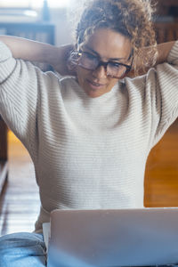 Midsection of woman using mobile phone