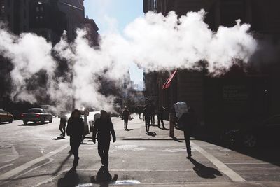 People walking on road in city