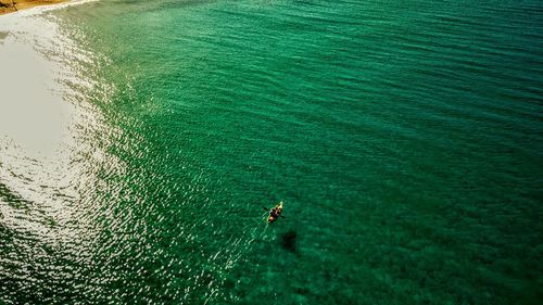 High angle view of man surfing in sea