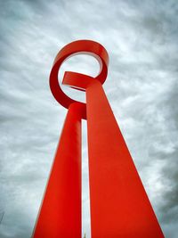 Low angle view of sign against sky