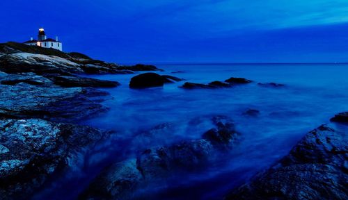 Scenic view of sea against sky at dusk